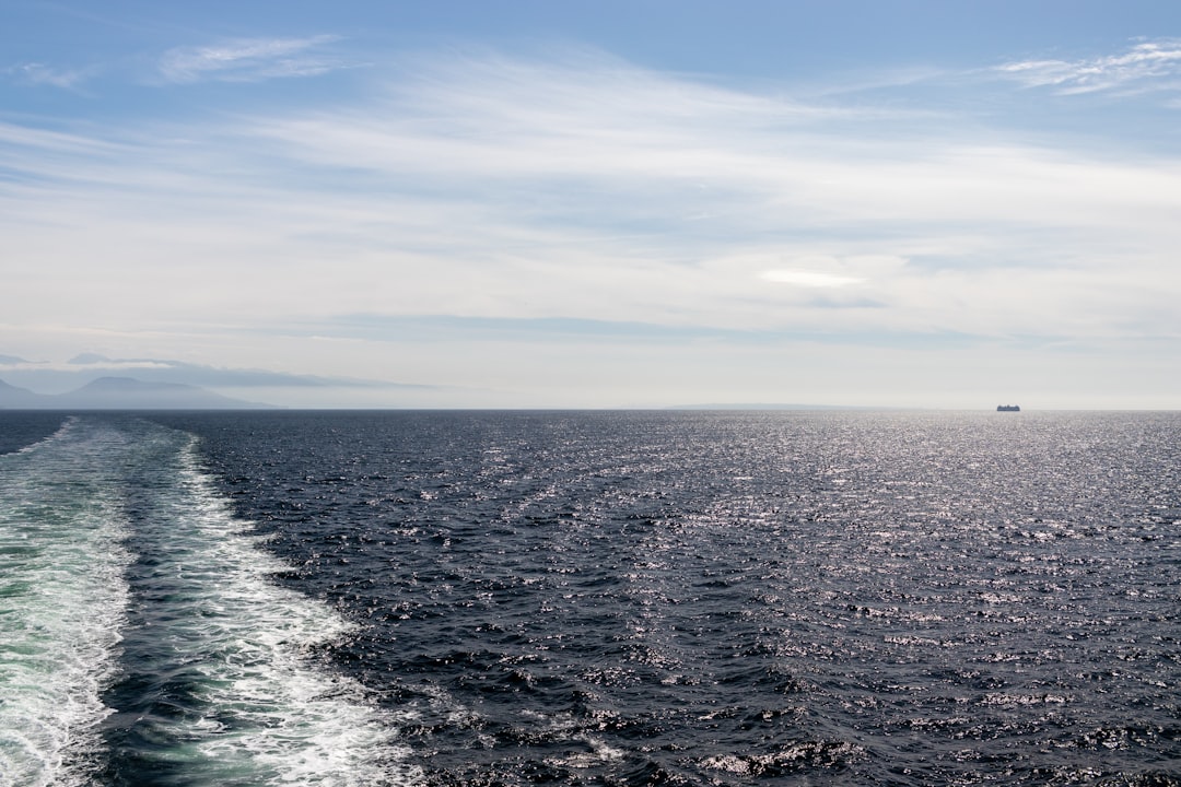A French naval aircraft carrier sailing through open waters.